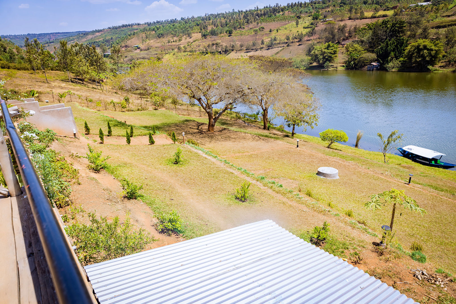 Green lawns rolling down to Lake Muhazi