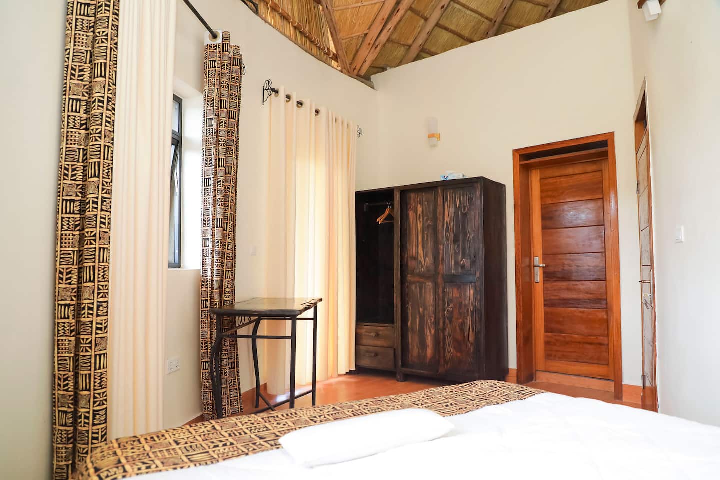 Bedroom in the annexe house with carved door