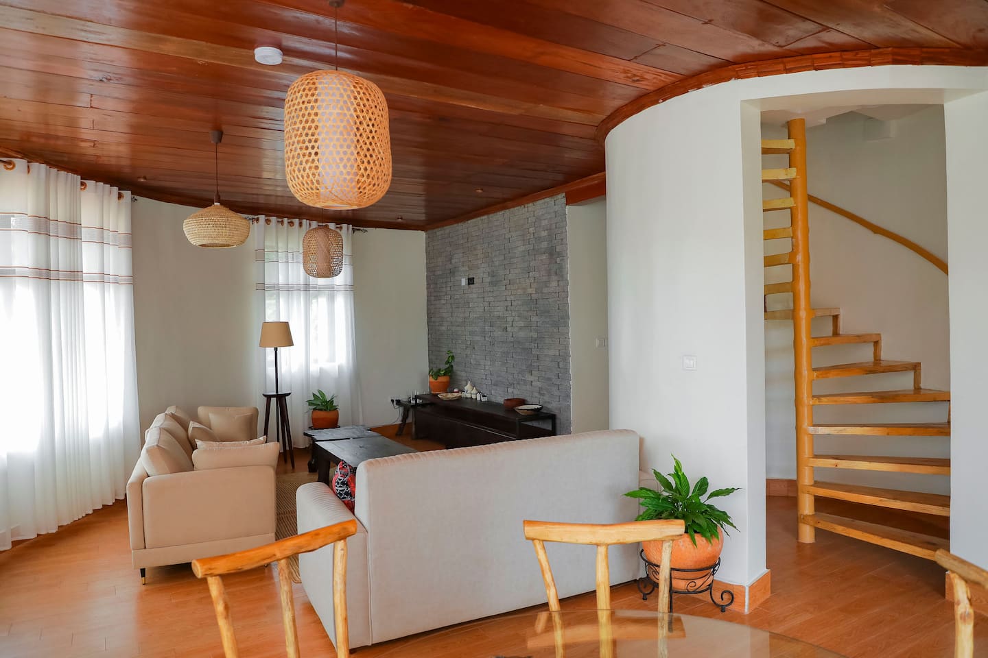 Living area with spiral staircase to the upper floor