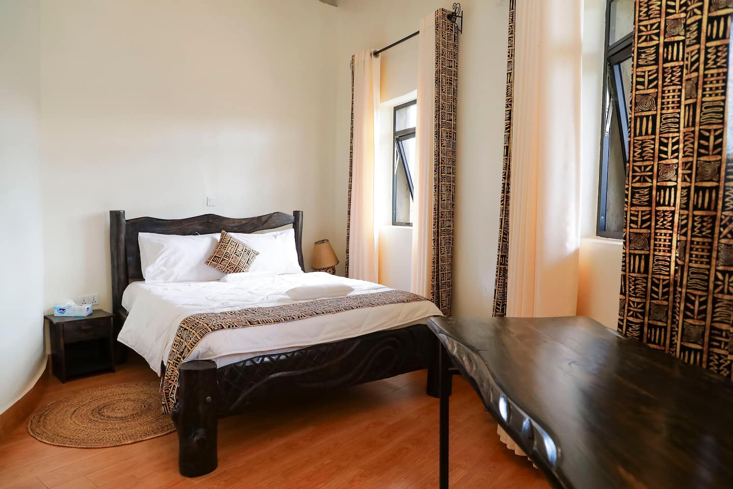 Bedroom with dark hardwood bed frame and garden window